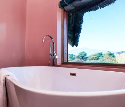 En-suite bathroom with bathtub